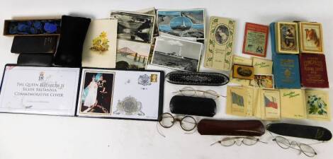 Bygones, collectables, etc. a papier mache spectacles case, 19cm W, Jubilee Mint coin, various spectacles, Collins VP Reckoner Mauchline ware needlecase, other books, ephemera, Congress playing cards, cigarette silks, postcards to include Cunard Ship, etc