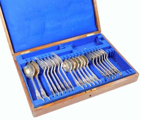 A Victorian silver cutlery set, shell capped king's pattern, comprising two serving spoons and six of each entree forks, dinner forks and dessert spoons, Sheffield probably 1895, in an oak cased canteen, 40cm W, 52oz.