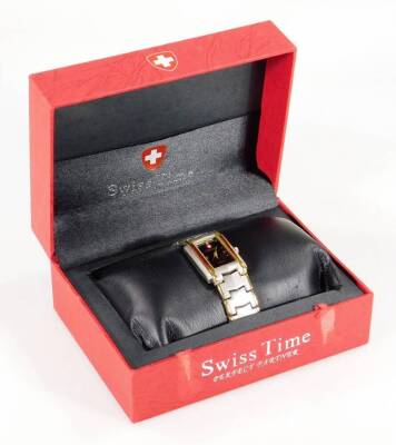 A ladies Swiss Time fashion watch, with 2cm W dial, boxed with identification card.