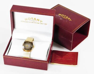 A Rotary gentleman's 9ct gold cased wristwatch, c1996, brown dial bearing batons, subsidiary seconds dial and date aperture, model no 2493128, on a plated strap, boxed with certificate, 44.9g all in.