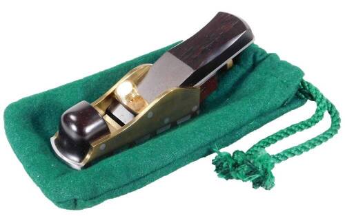 A Karl Holtey 7.5" thumb plane, with single thread adjuster, shaped handle and infill and brass mounts, marked Holtey Finmere, 17cm W, in baize pouch. (unused)