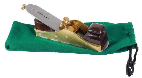 A Karl Holtey 12" mitre wood plane, with twin thread adjusters, stepped front handle, brass sides dovetailed onto steel, 32cm W, in baize pouch. (unused)