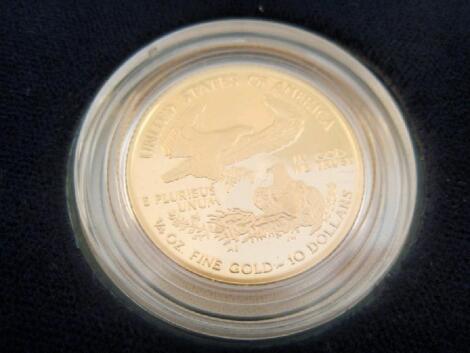 A boxed American eagle one quarter ounce proof gold bullion coin