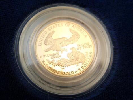 A boxed American eagle one tenth ounce proof gold bullion coin