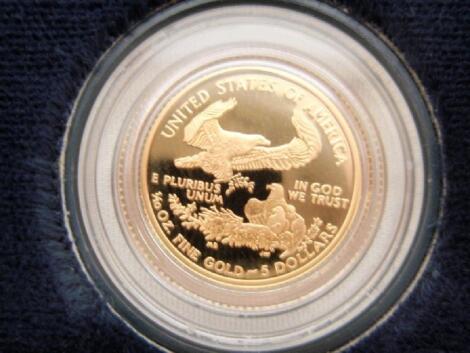 A boxed American eagle one tenth ounce proof gold bullion coin