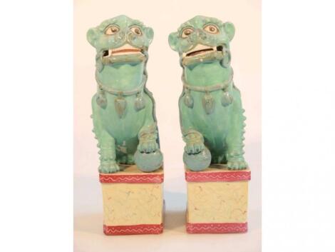 A pair of Chinese earthenware figures of dogs of Fo