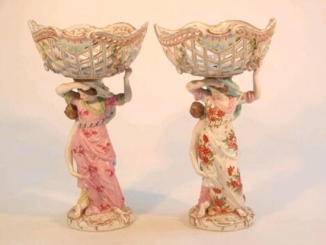 A pair of 19thC German porcelain pedestal baskets