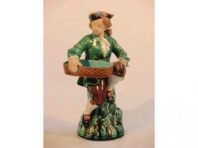 A Minton's majolica figure of a boy