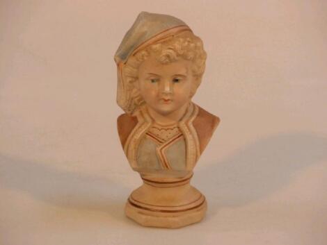 A German bisque bust of a young boy