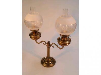 A brass double oil lamp