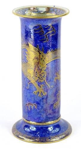 A Wedgwood dragon lustre cylindrical vase, decorated in gilt, on a mottled blue ground, 28cm H.