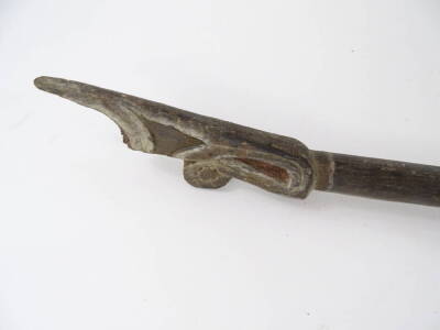 A Papua New Guinea tribal paddle, with carved blade, tapering handle and shaped finial, bearing label stating Aborigine boat paddles, brought to England 1910, 182cm L. - 2