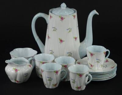 A Shelley part tea service, printed with pink and blue flowers, on a cream ground with blue handles interiors etc., pattern number 2296.