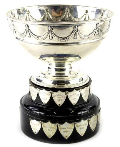 A George V silver goblet shaped trophy, decorated with swags etc., titled The Cheshire Bowl, London 1913, on ebonised plinth, each engraved with various names etc., 8½oz, 17.5cm dia.