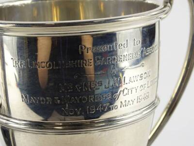 A George V silver two handled trophy, engraved Presented to the Lincolnshire Gardeners Association by Mr and Mrs J W Lawson, Mayor and Mayoress of City of Lincoln, November 1947- May 1949, Birmingham 1923, 15¼oz, with ebonised plinth engraved with various - 3