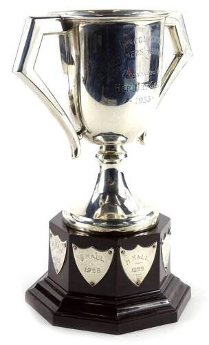 A George V silver two handled trophy, engraved Lincolnshire Gardeners Association presented by Herbert Green 1933, applied to a Bakelite base engraved with various names, Birmingham 1931, 5¾oz, 23cm H overall.