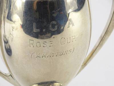 A George V silver two handled cup, engraved L.G.A Rose Cup (amateurs), Birmingham 1930, 8½oz, on ebonised wooden plinth engraved with various names. - 3