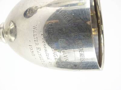 A George V silver goblet shaped trophy, engraved Lincolnshire Gardeners Association, The Rayner Challenge Cup, presented by Walter Rayner Esquire 1938, Birmingham 1932, 14¾oz, 26cm H, and a black Bakelite plinth engraved with various names. - 3