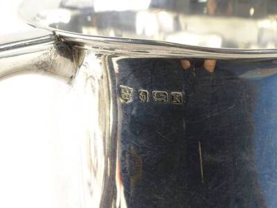 A George VI two handled silver cup, engraved Lincolnshire Gardeners Association The Parker Challenge Cup presented by Alderman C.T Parker CBE, JP 1938, Birmingham 1937, with iron screw attached, 14oz gross, on a black Bakelite base engraved with various n - 2