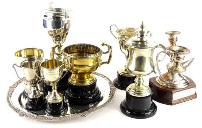 A collection of silver plated trophies, a three branch candelabra, and a salver, mainly relating to gardening.