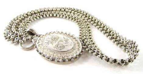 A Victorian silver locket and chain, the locket of oval form with floral etching, on two row chunky chain, 47.5g all in.