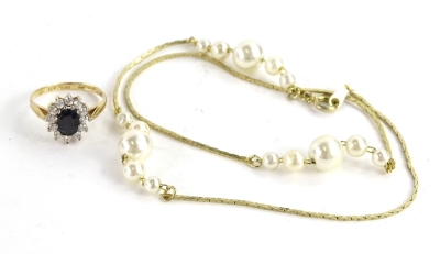 Two items of jewellery, to include a 9ct gold dress ring, set with CZ stones, and a gold plated faux pearl necklace. (2)