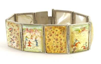 An Oriental style bracelet, with nine painted mother of pearl rectangular panels, depicting birds, flowers and figures, in white metal surround, unmarked, 19cm long overall.