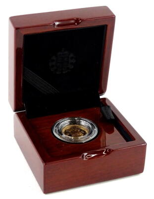 A 2017 miniature gold coin, in fitted case.