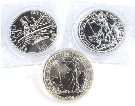 Three silver Britannia coins, comprising 2011, 2002 and 2012.