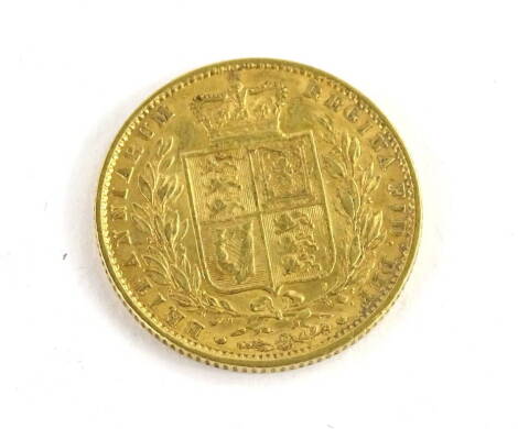 A Queen Victoria 1860 full shield Britanniarum sovereign.