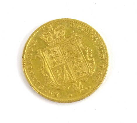 A Queen Victoria 1842 half gold shield sovereign.