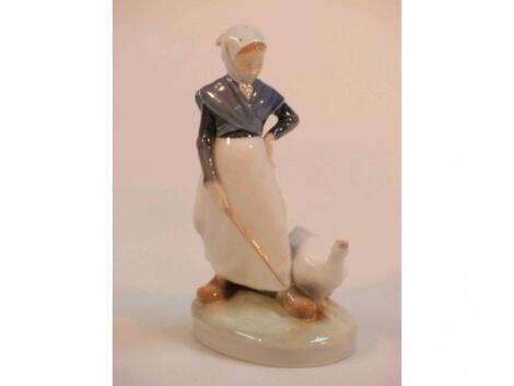 A Royal Copenhagen figure of a goose girl with goose