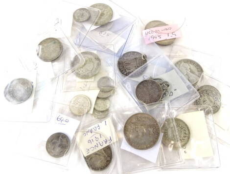 Twenty three various silver foreign coins.