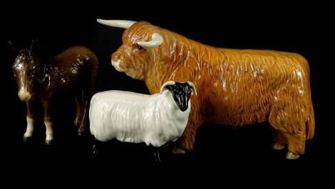 A Beswick model of a Highland cow, a donkey and sheep. (sheep AF)