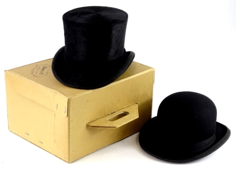 A Scott and Co of Piccadilly bowler hat, and a Dunn and Co top hat, in original box. (2)