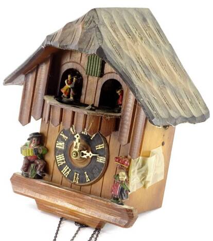 A Swiss type cuckoo clock, decorated with composition figures etc. (AF)