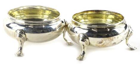 A pair of early Victorian silver circular salts, each on three shaped legs with pointed pad feet, London 1839, 6oz.