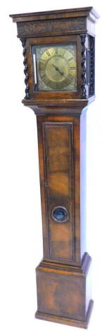 A grandmother clock, with a brass square dial, thirty hour movement in a walnut case, in early 18thC style, 181cm L.