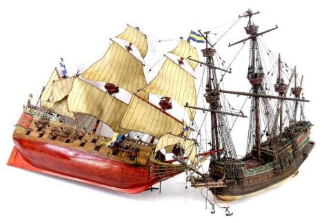 Two models of galleons, each with four masts, partially painted etc., the largest 63cm L.