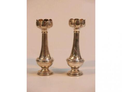 A pair of silver posy vases