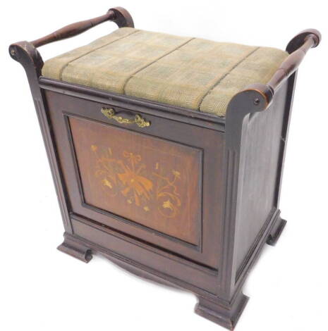 An Edwardian mahogany and marquetry music stool, with a padded seat above four front drawer enclosing a compartment for sheet music, on ogee bracket feet, 51cm W.