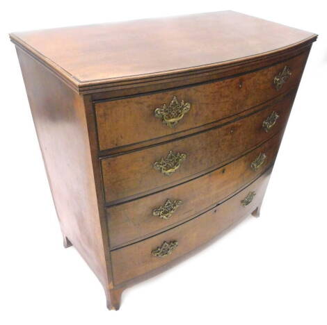 A 19thC plum pudding mahogany bow fronted chest of drawers, the top with a reeded edge above four graduated drawers each with ebony strung edges and pierced brass handles and splayed feet, 108cm W.