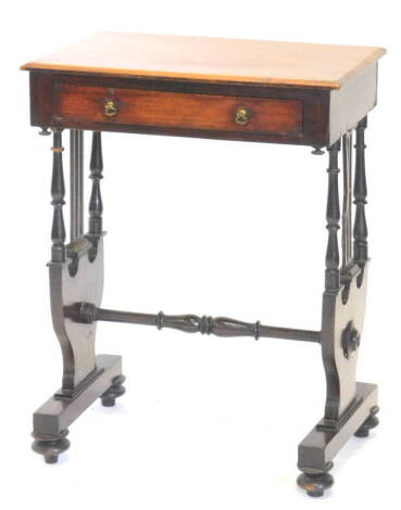 A Victorian mahogany work table, the rectangular top with a canted edge above a frieze drawer on shaped partly turned and pierced end supports with stretcher on bun feet, 68cm H, 51cm W.