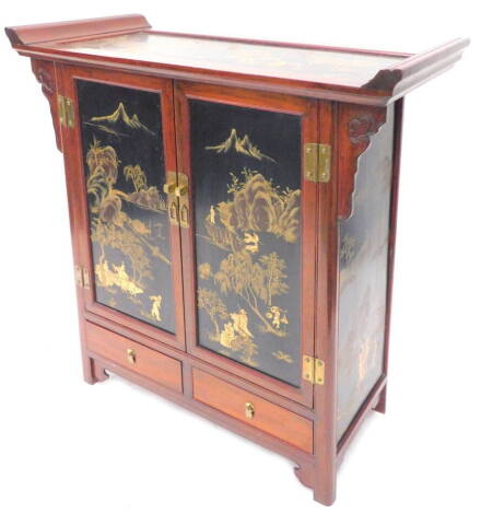 An oriental elm side cabinet, decorated with black lacquer panels of figures, trees, rivers etc., the rectangular top with raised sides, above two panelled doors, and two drawers on stiles with brackets, 82cm W.