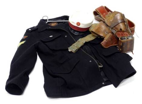 A collection of American leather holsters, a pair of binoculars, a top man jacket and trousers converted into an Army type uniform, and a cap.