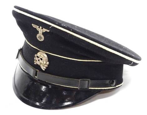 A German SS style Third Reich cap, with two metal badges.