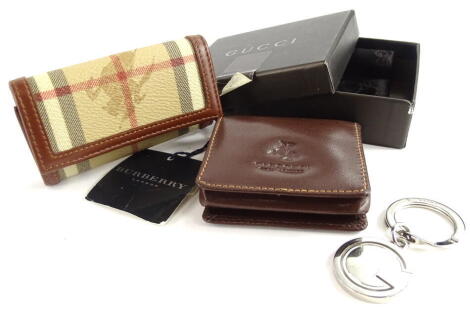 A Burberry brown leather coin purse or wallet, and a small Burberry key purse etc.