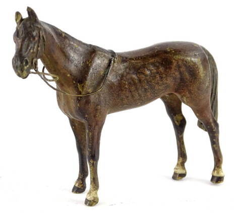 An early 19thC Austrian cold painted bronze model of a racehorse, with bridle etc., 11cm L.