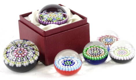 A collection of small Perthshire glass paperweights, each with millefiori design, and a limited edition miniature millefiori weight designed by Stuart Drysdale, number 53 of 450 pieces in original box, with certificate.