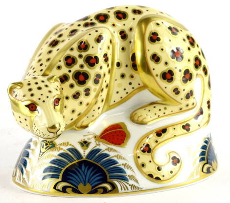 A Royal Crown Derby porcelain Savannah leopard, from the endangered species made for Sinclairs, printed mark in red to underside, gold button, boxed, 17cm W.